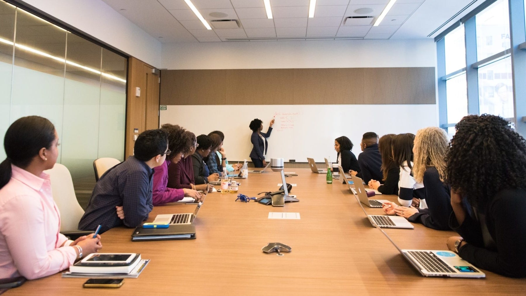 People at a meeting listening to presenter